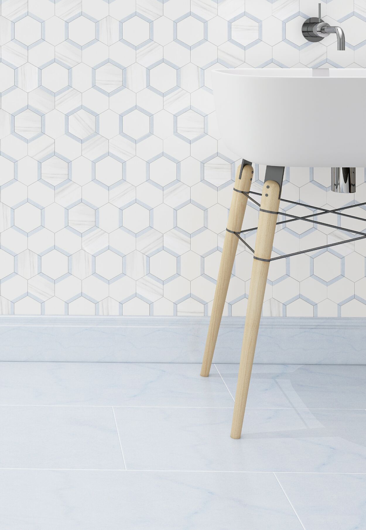 White sink with light wood legs, mounted on blue-tiled wall with geometric design, light blue floor.