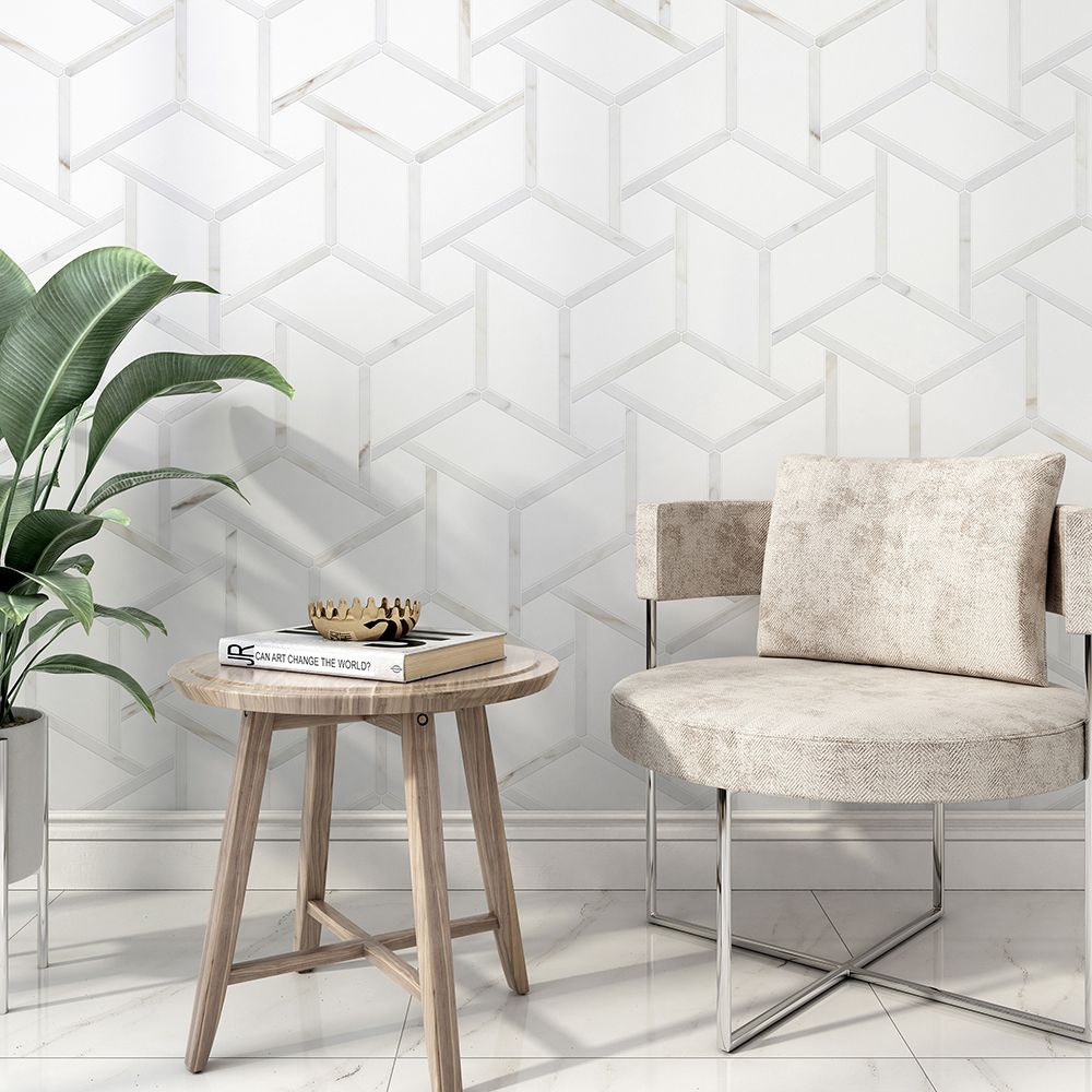 White geometric tile wall with a chair, small table, and plant in a room.