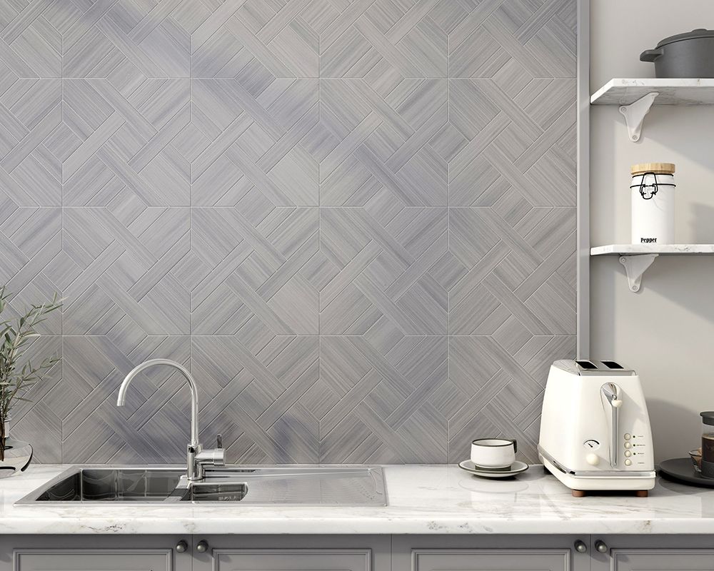 Kitchen with a tiled backsplash, sink, and countertop. Toaster and shelves visible.
