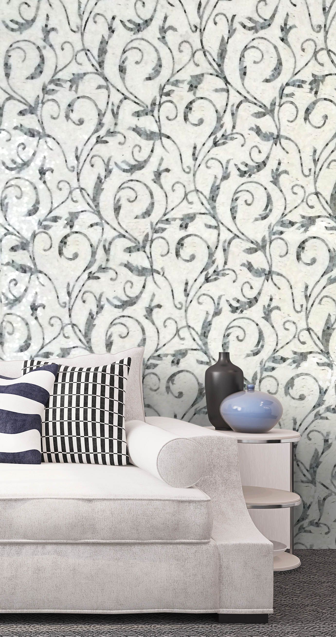 Sofa with patterned pillows and decor against a wall with floral design.