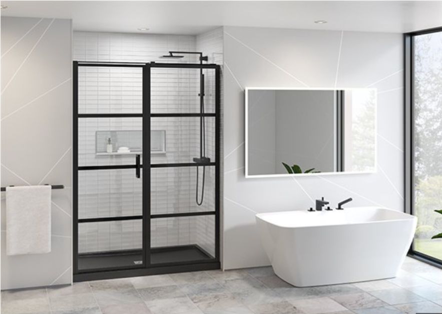 Modern bathroom with black-framed shower, white bathtub, large mirror, and window.