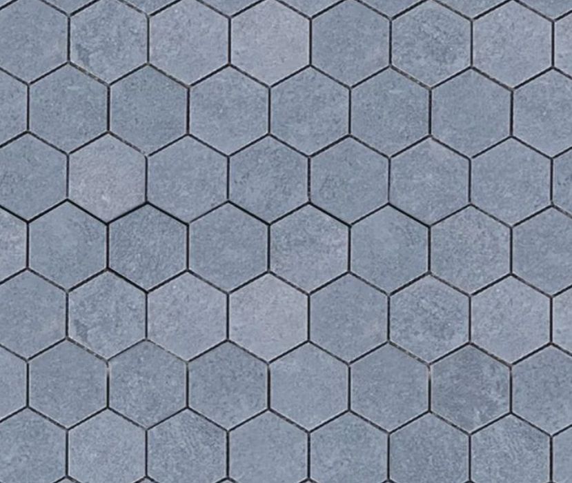 Gray hexagonal pavers arranged in a repeating pattern.