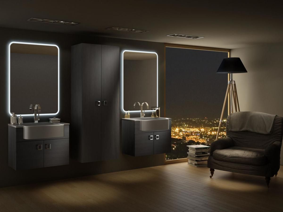 Dark gray modern bathroom with illuminated mirrors, cabinetry, and a cityscape view.