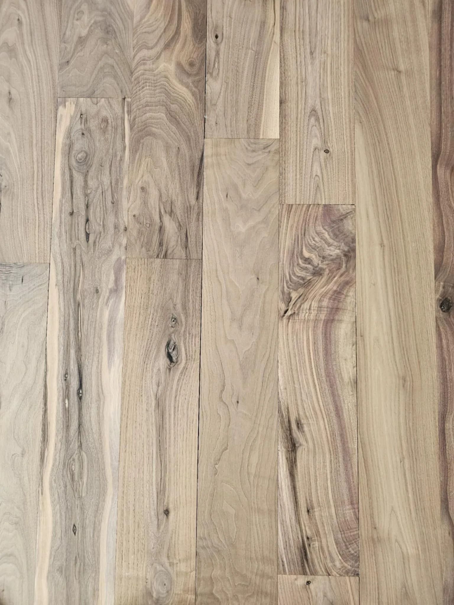 Light wood plank flooring with natural grain and knots