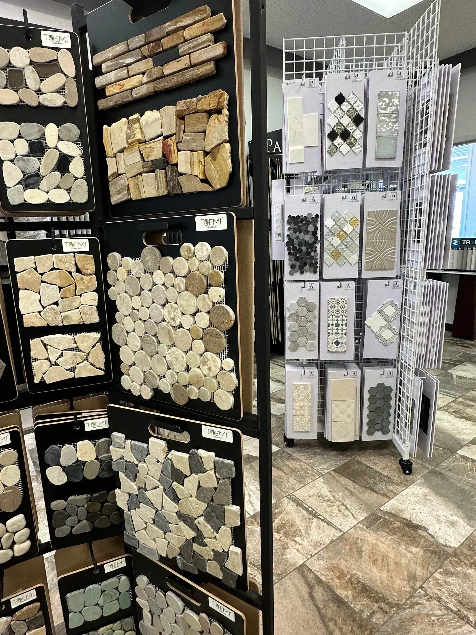 Retail display racks of decorative wood slices and craft embellishments in a store aisle