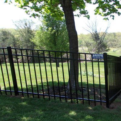 A black fence with a sign that says armor on it