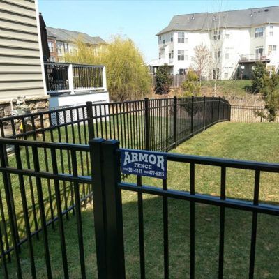 A black fence with a sign that says armor on it