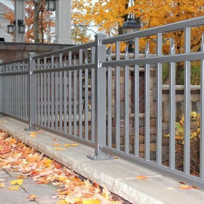 A white fence with a house in the background