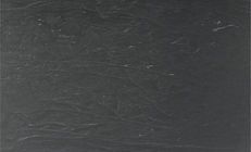 Dark gray, textured surface with subtle variations and slight imperfections.