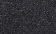 Black textured surface with small, irregular granules.