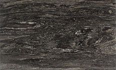 Dark gray and black striated stone with white flecks and wavy patterns.