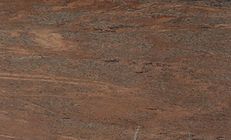 Red-brown granite with dark horizontal streaks.