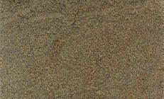 Close-up of a pile of coarse, granular, brown material, possibly soil or gravel.