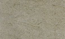 Close-up of a beige, textured stone surface with subtle veining and small dark specks.