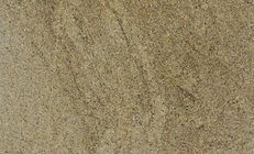 Close-up of tan sand with subtle variations in color and texture.