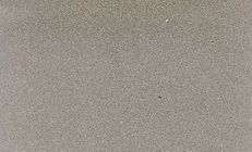 Close-up of beige, sandy texture, likely a beach or desert.