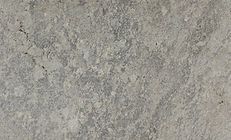 Textured, light gray surface with mottled patterns and subtle variations in tone.