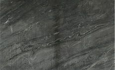 Dark gray stone surface with swirling patterns and subtle texture.