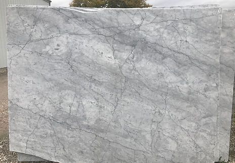 Gray marble slab with veining and a smooth surface.