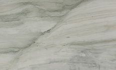 White and gray marble slab with veining and subtle green and tan hues.