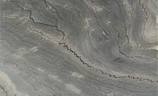 Gray marble slab with swirling patterns and crack veins.