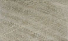 Gray-beige stone slab with wavy veining and light, linear markings.