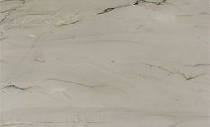 Light beige marble with gray veining and subtle textures.