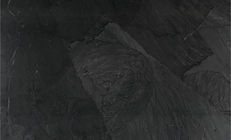 Dark gray slate-like background with textured surface and subtle light variations.