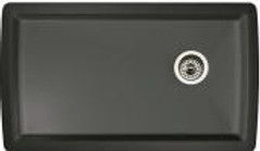 Dark gray rectangular kitchen sink with a drain and a slight curve on the edges.