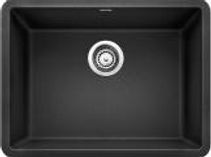 Black, rectangular kitchen sink with a circular drain in the center.