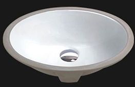 Oval, white ceramic bathroom sink with a drain hole.