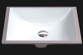 White rectangular bathroom sink with a curved interior and a drain hole.