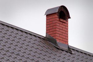 Roofing with brick chimney