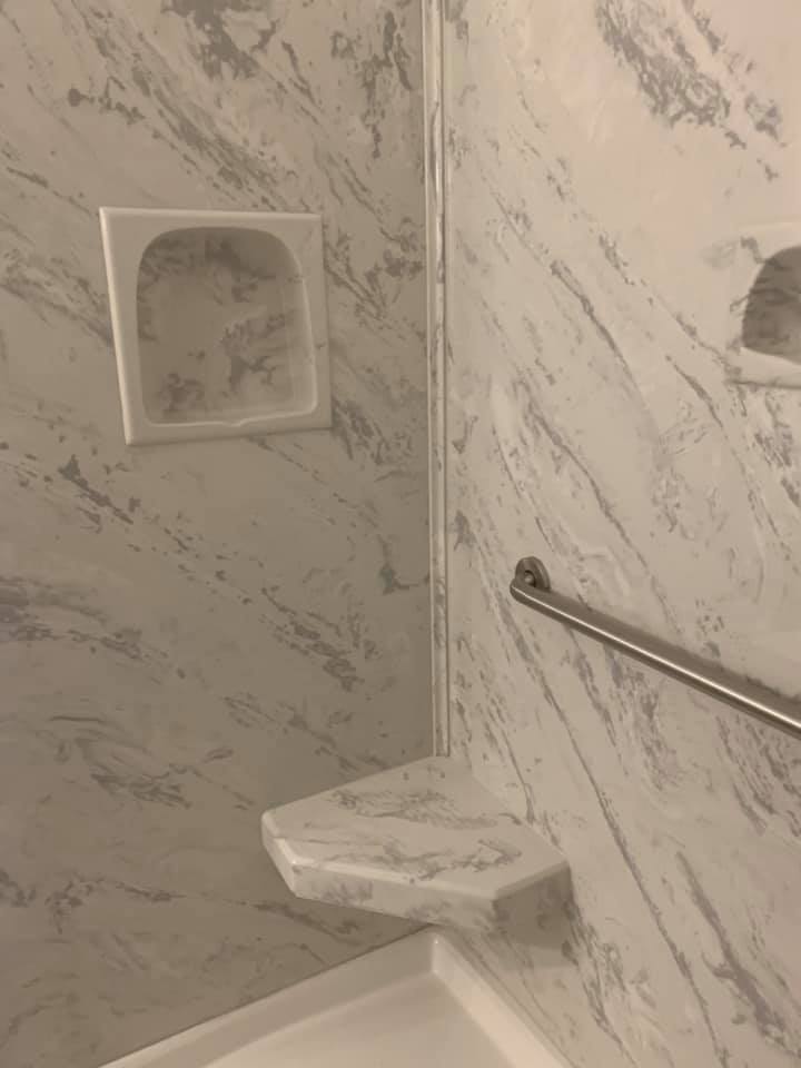 Recessed soap dish on tiled shower wall