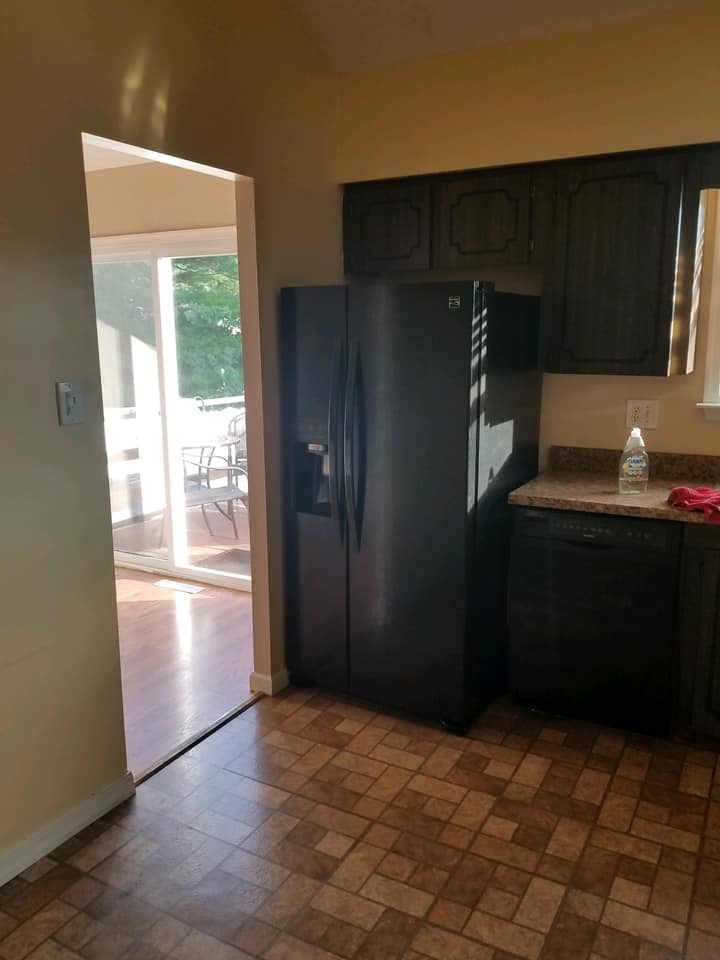 Kitchen with black colored refrigretor