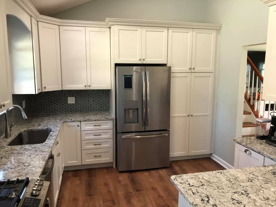 Kitchen with white colored cabinets