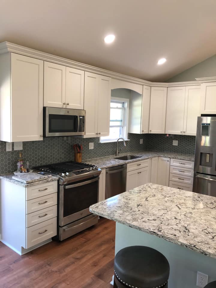 Small kitchen with white cabinets