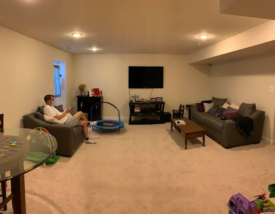 Man sitting in sofa in the living area