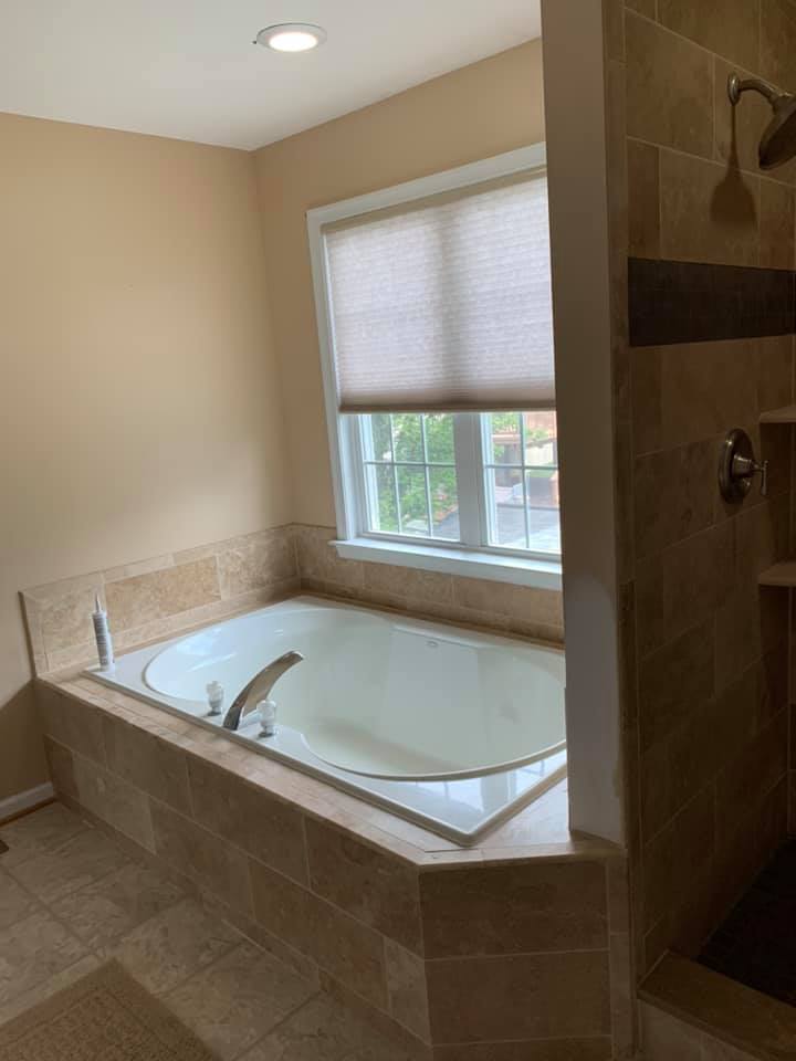 Bathtub beside window
