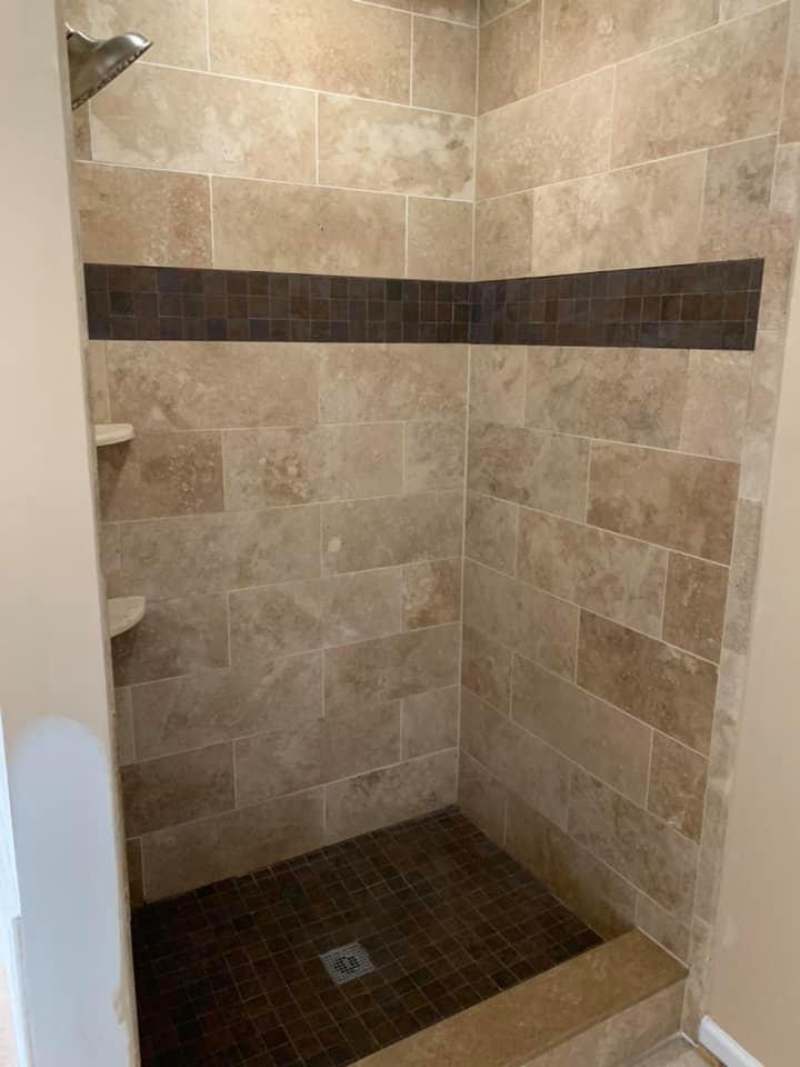 Brown tiled shower area