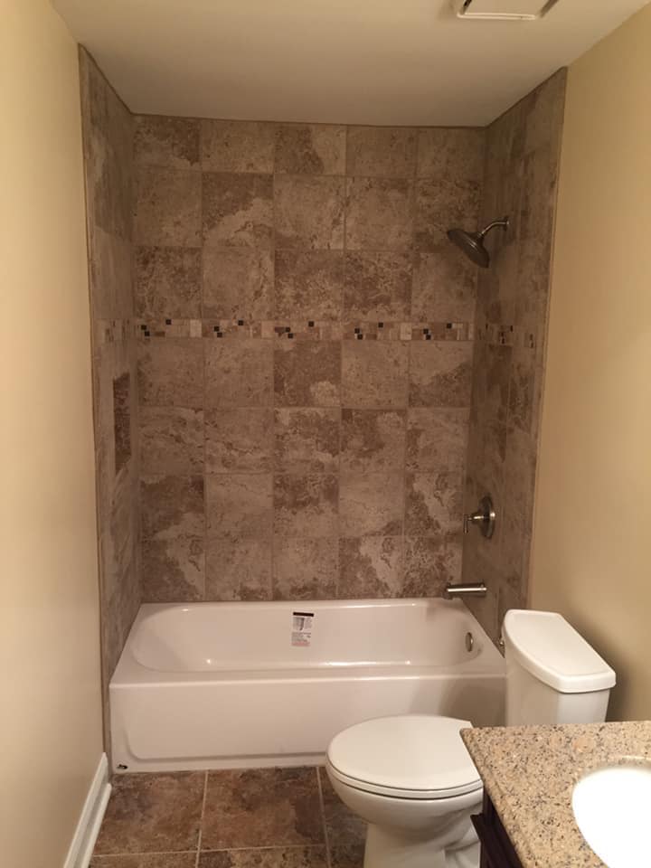 Small bathroom with bathtub and toilet