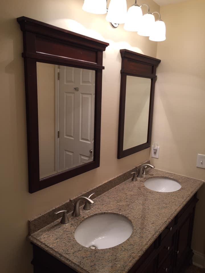 Two mirrors and two sink