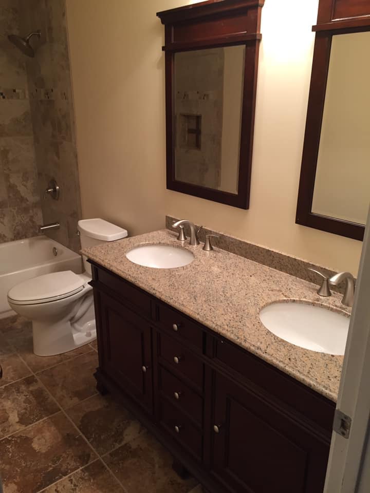 Bathroom with two mirrors and two sink cabinet