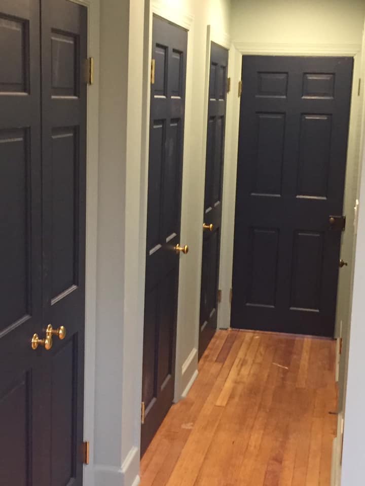 Four dark blue doors