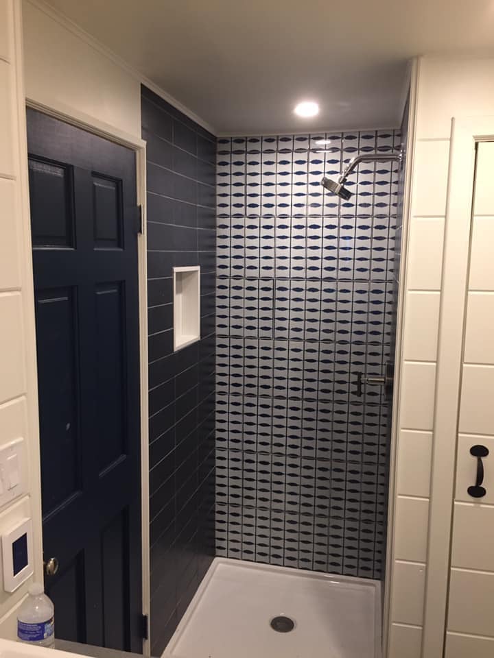 Classy bathroom with bathtub and large painting