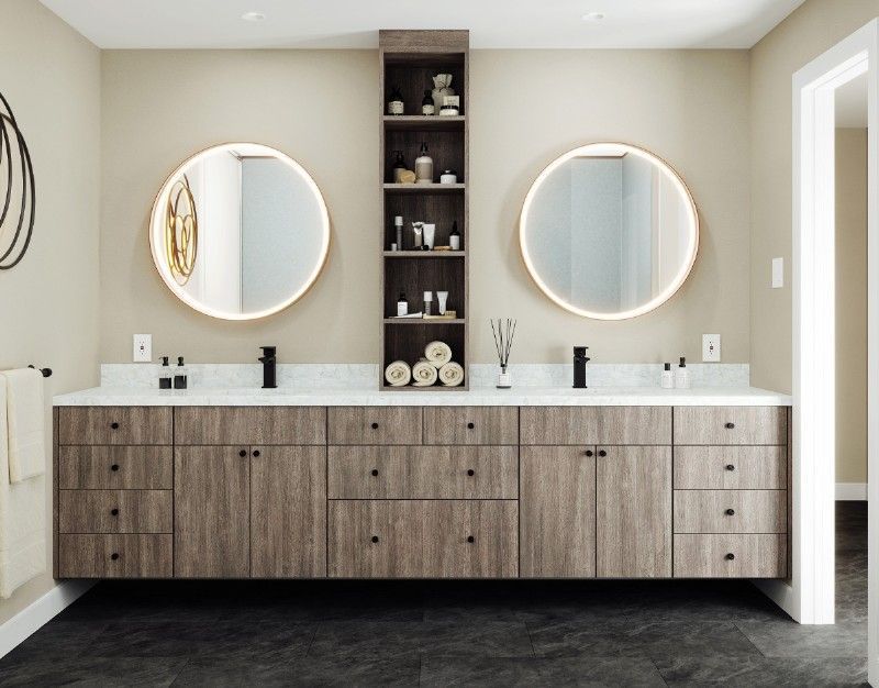 A bathroom with two sinks and two mirrors