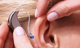 Attaching hearing aid