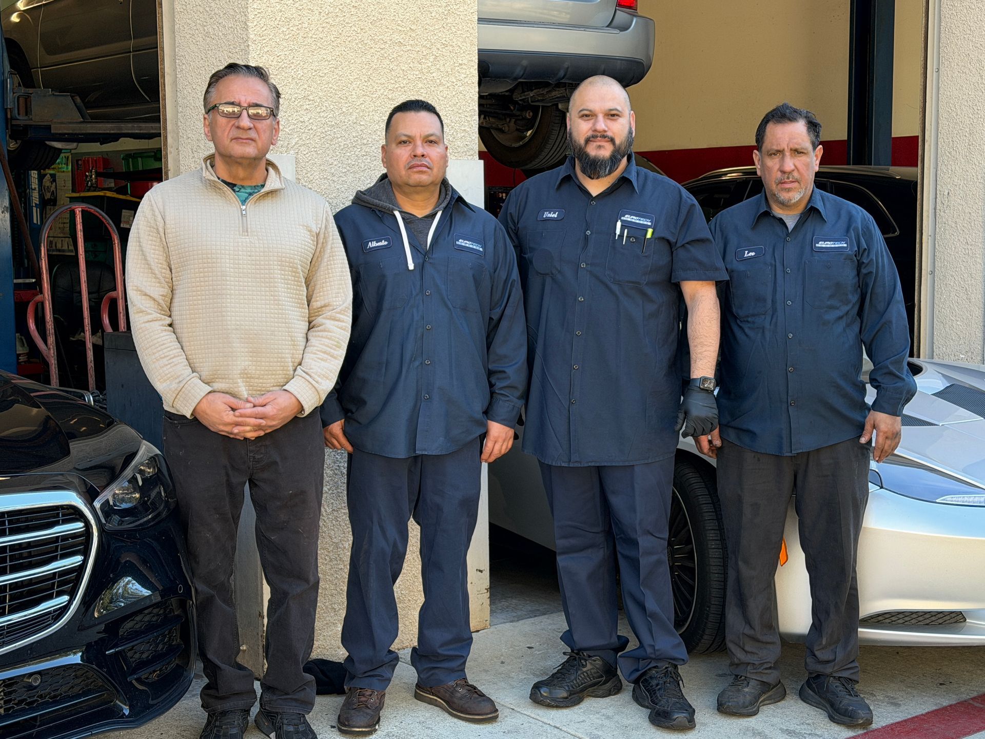 Close-up of a cut-away car transmission showing gears and mechanical components in a silver and gray casing.