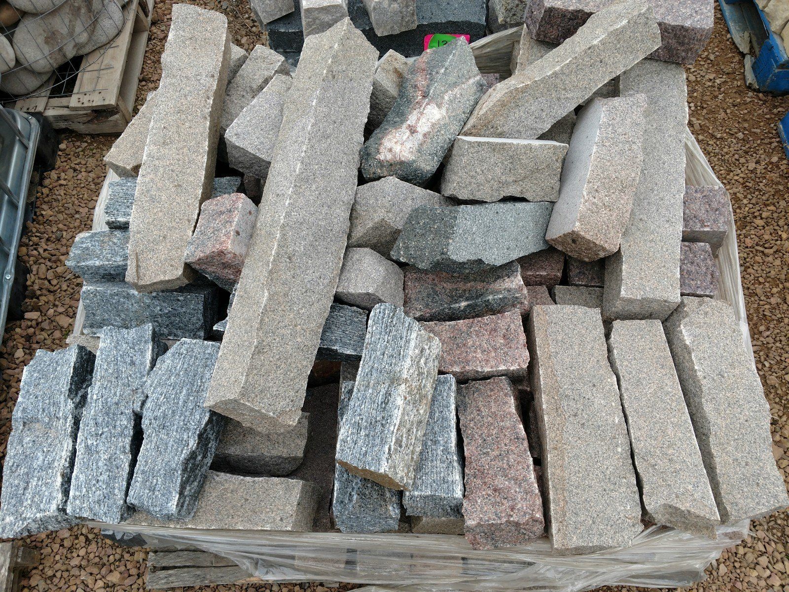 A pile of rocks is sitting on top of a pile of gravel.
