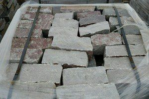 A pile of bricks sitting on top of each other in a plastic bag.